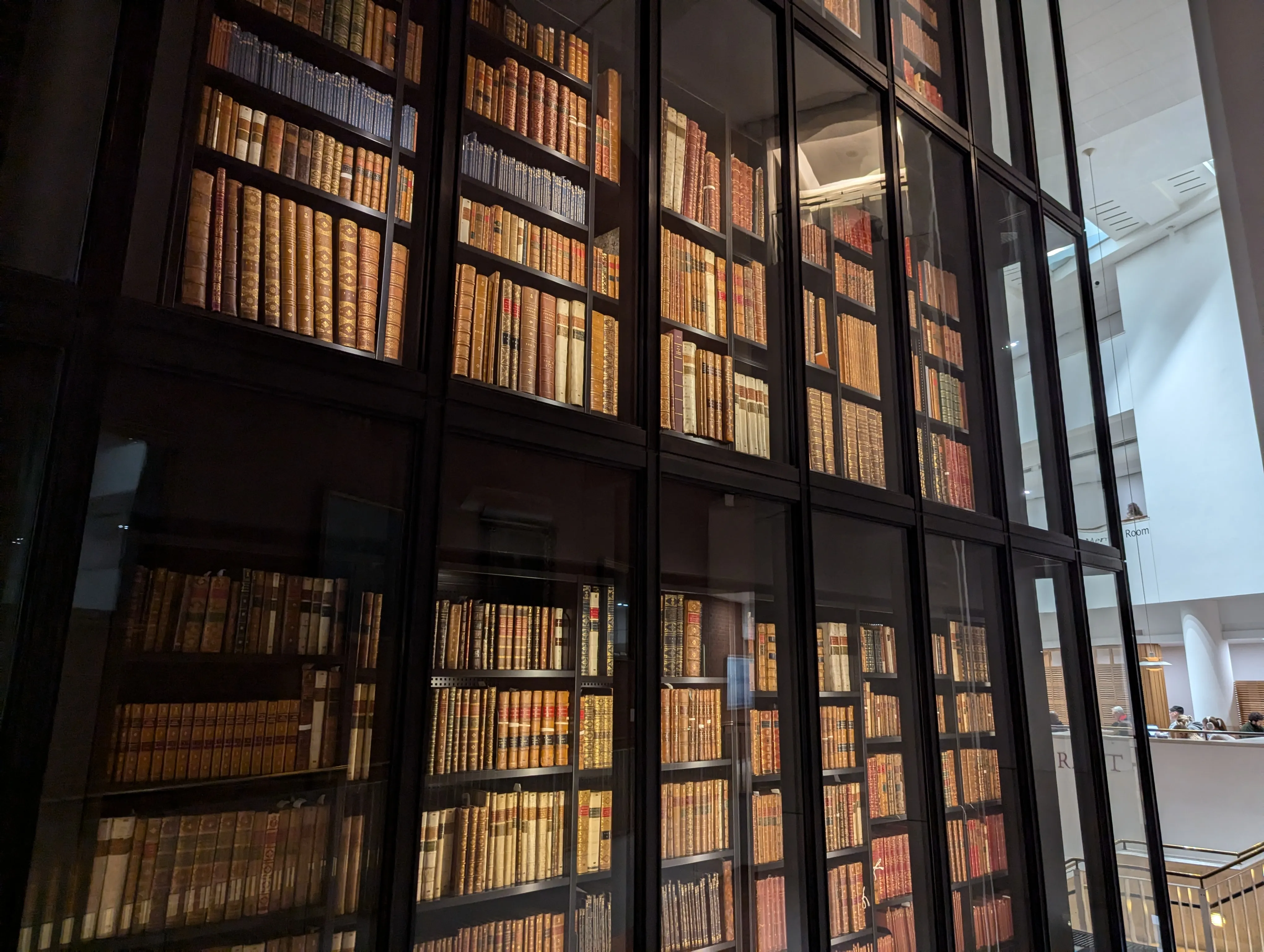 Shelves of books protected by glass