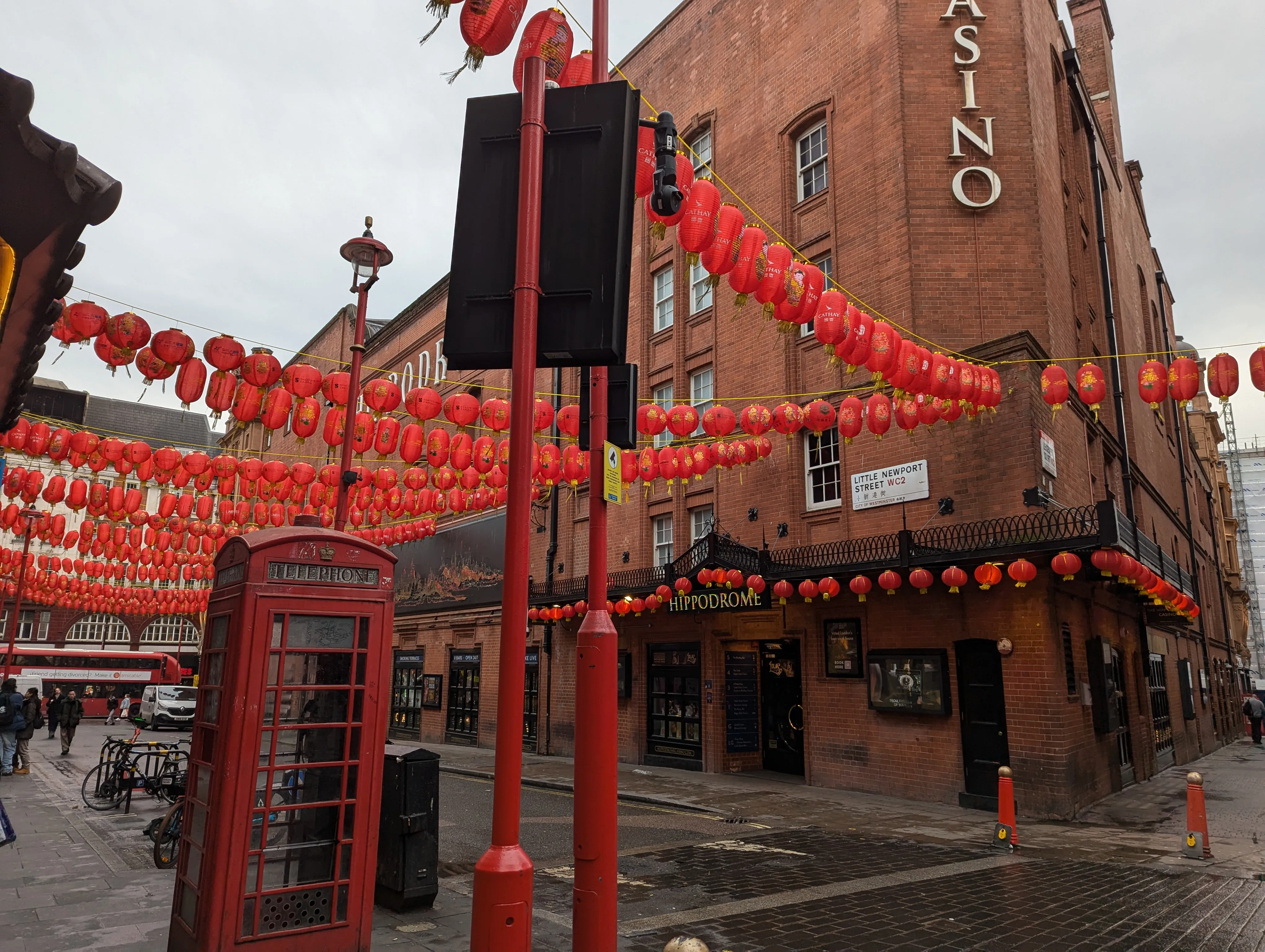 Phone booth with paper lanterns in the background